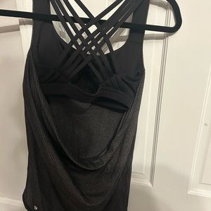 lululemon tank top. black with gray strips with bult in black sports bra